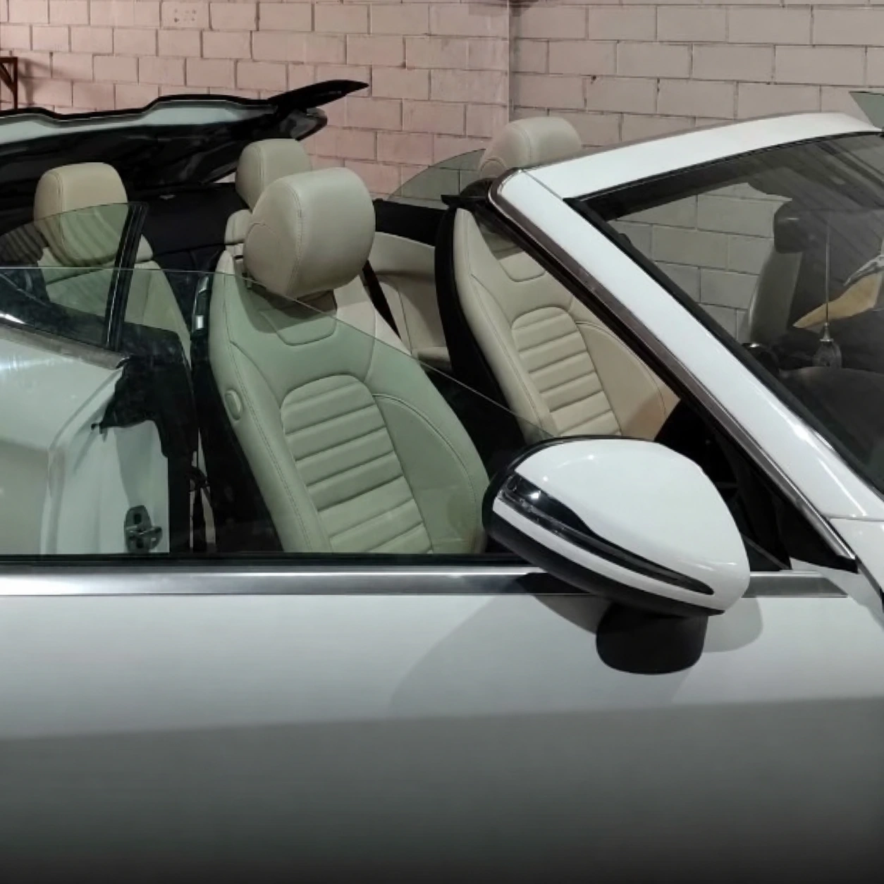 Cream seats in a white Mercedes-Benz convertible