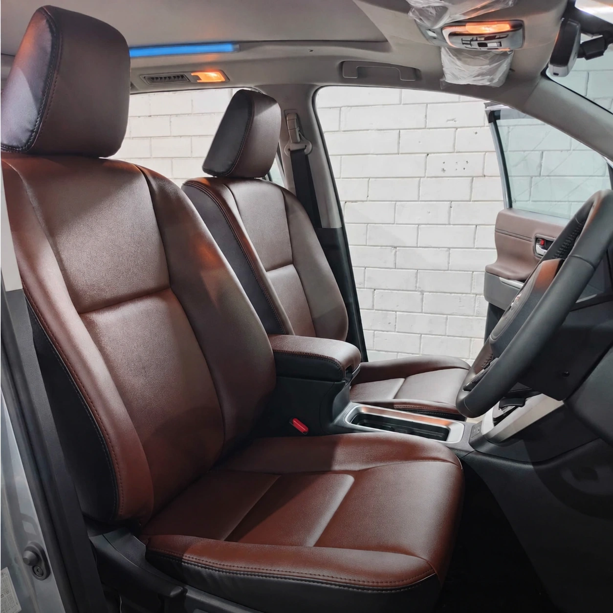 Brown front seats in an Innova